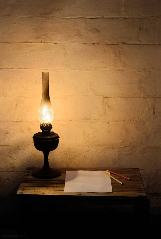 Kerosene lantern on wooden table - Сергей Огарёв