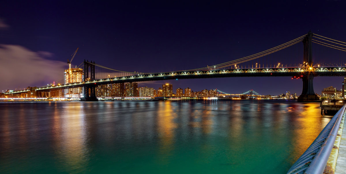 Panorama of Manhattan Bridge in New York City at night - Valentyn Semenov