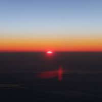 Восход солнца с борта самолета :: Александр Валяев